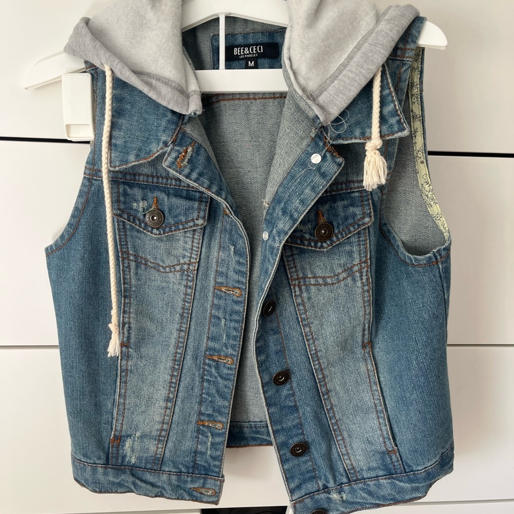 Really cute denim vest with gray sweatshirt style hood and draw strings!